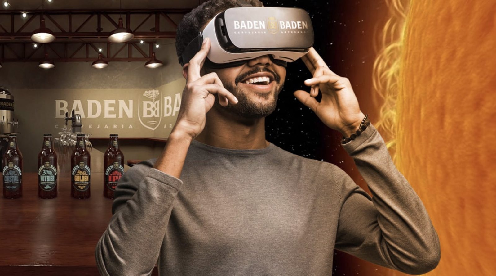 Smiling man wearing a Baden Baden VR headset inside the brewery, immersed in the tasting experience