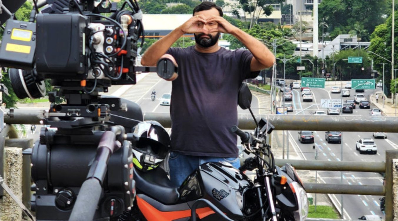 Behind the scenes of the campaign film: a motorcyclist framed by a cinema camera above Sao Paulo traffic